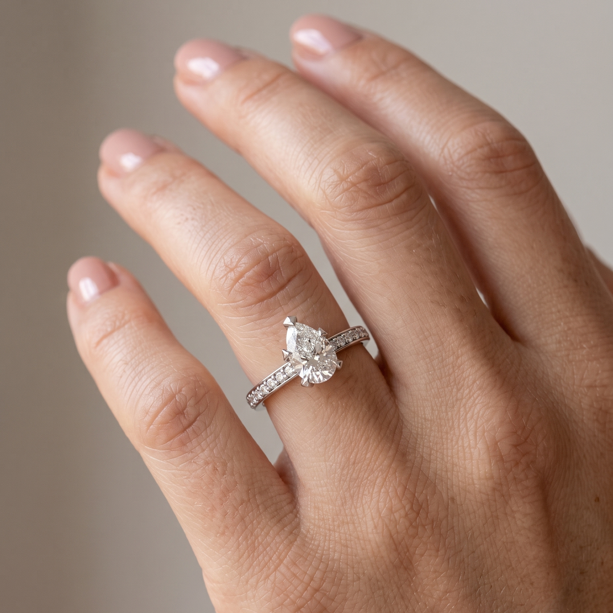 Pear Shape Diamond Solitaire Ring with Pavé Set Band