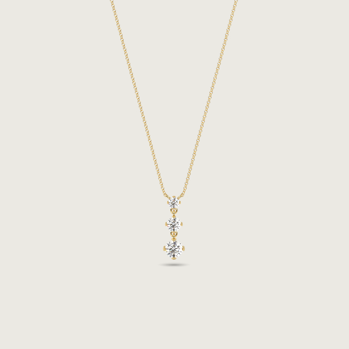 three stone diamond necklace - yellow gold
