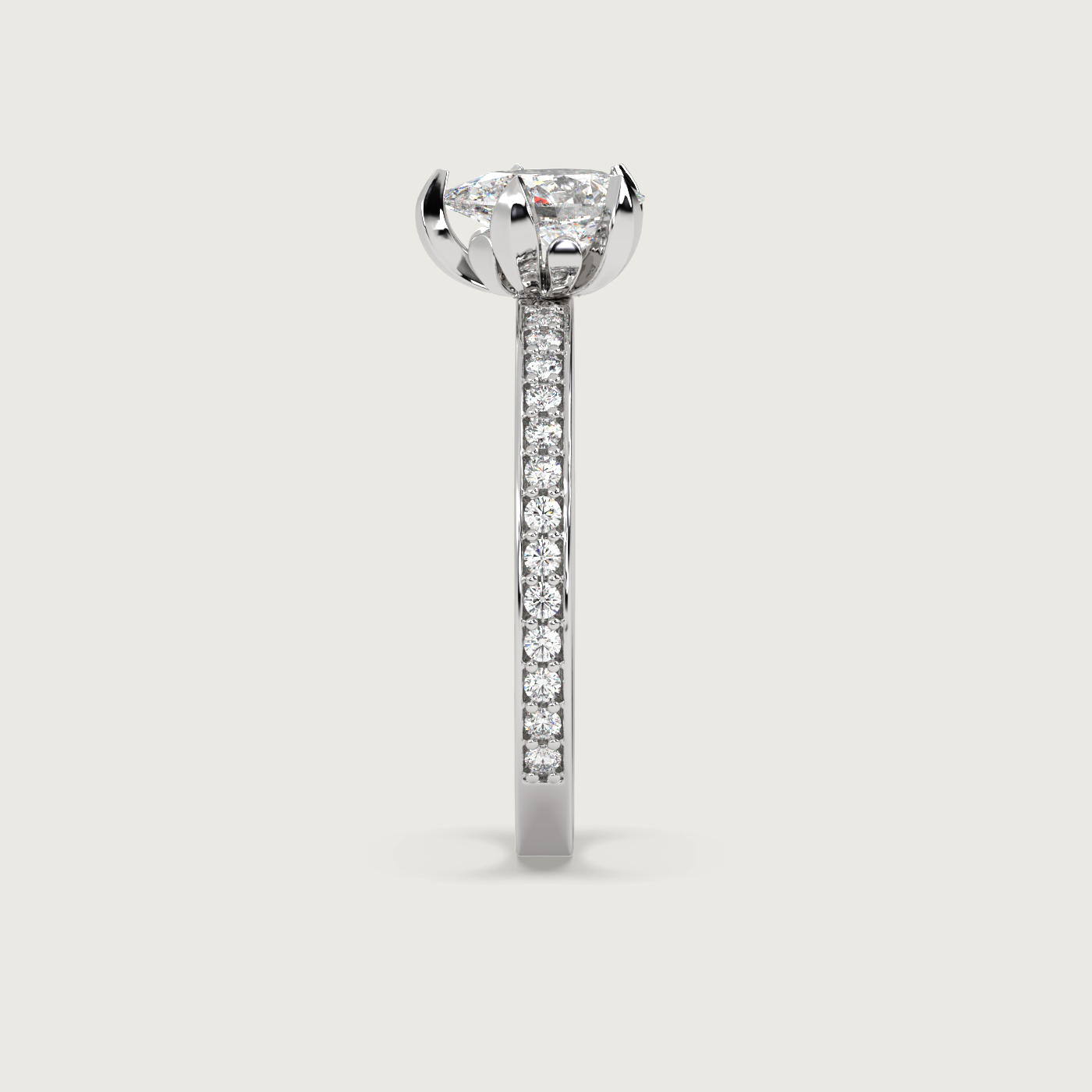 Pear Shape Diamond Solitaire Ring with Pavé Set Band in Fleur de Luce Setting