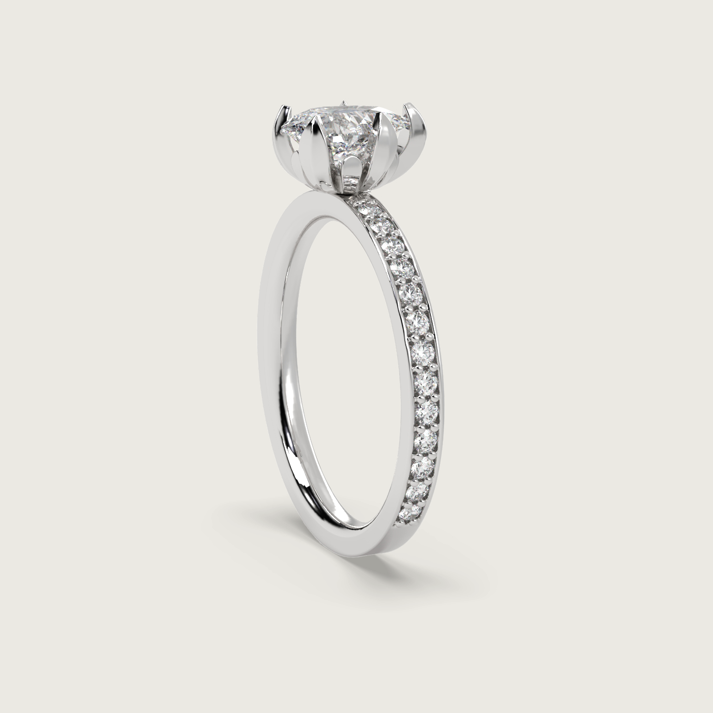 Pear Shape Diamond Solitaire Ring with Pavé Set Band in Fleur de Luce Setting