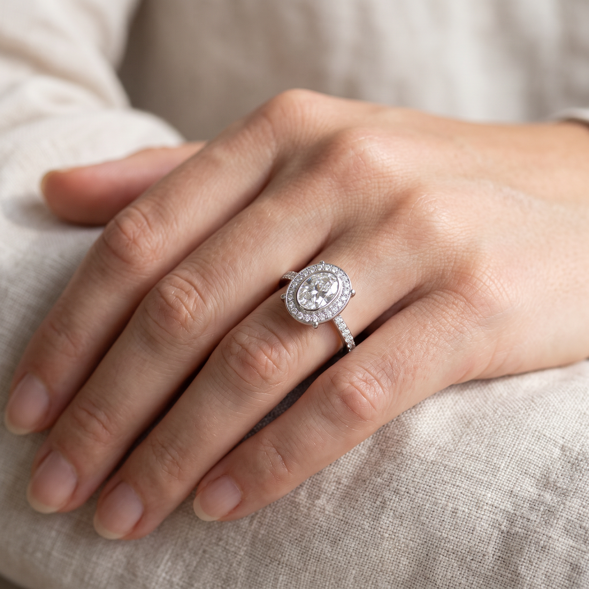 Oval Diamond Halo Engagement Ring with Pavé Set Band