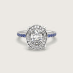 Oval Diamond Halo and Cornflower Blue Sapphire Pavé Engagement Ring in Fleur de Luce Setting