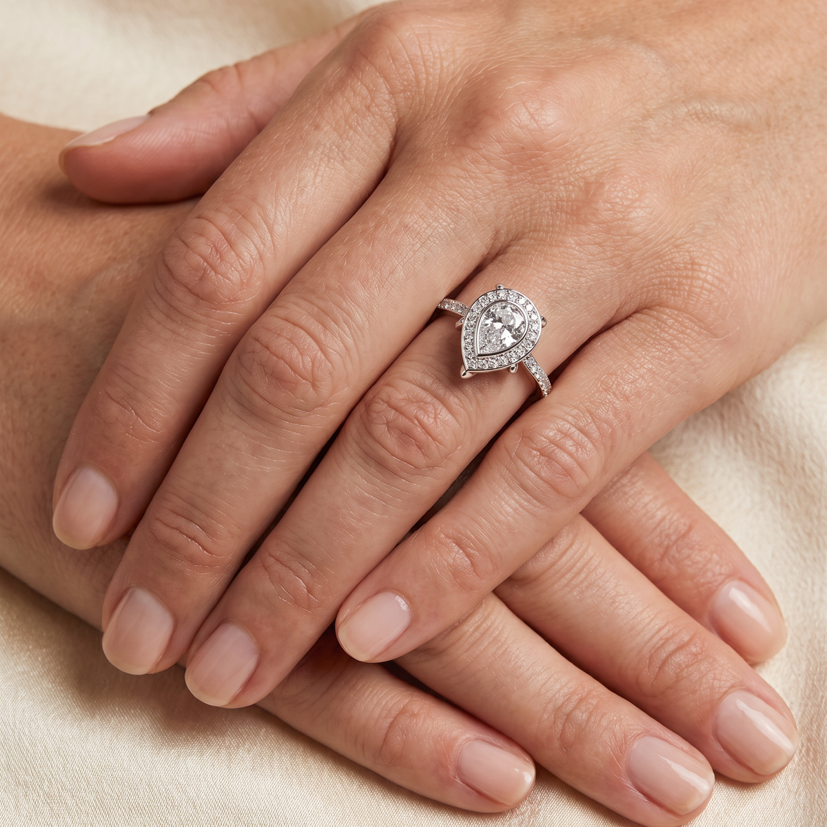 Pear Shape Diamond Halo Engagement Ring with Pavé Set Band